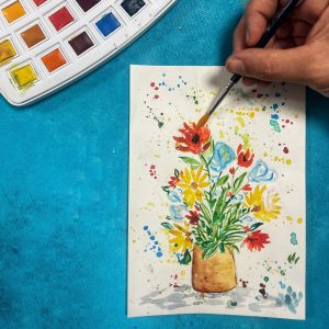 Materiales de acuarela botánica preparados para taller familiar en Valencia